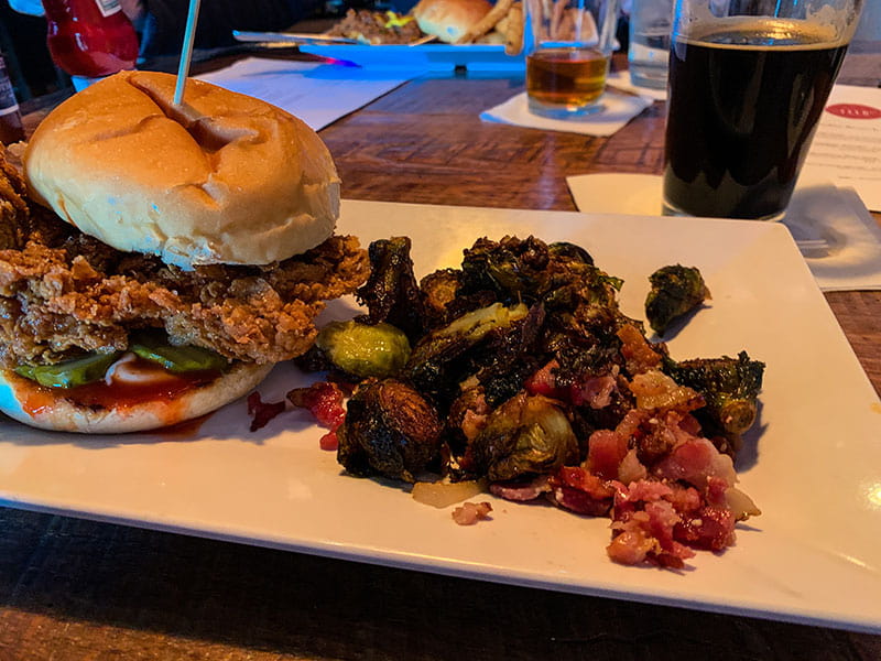 The Motherclucker sandwich and brussels sprouts at Feed & Table Tavern in Chattanooga