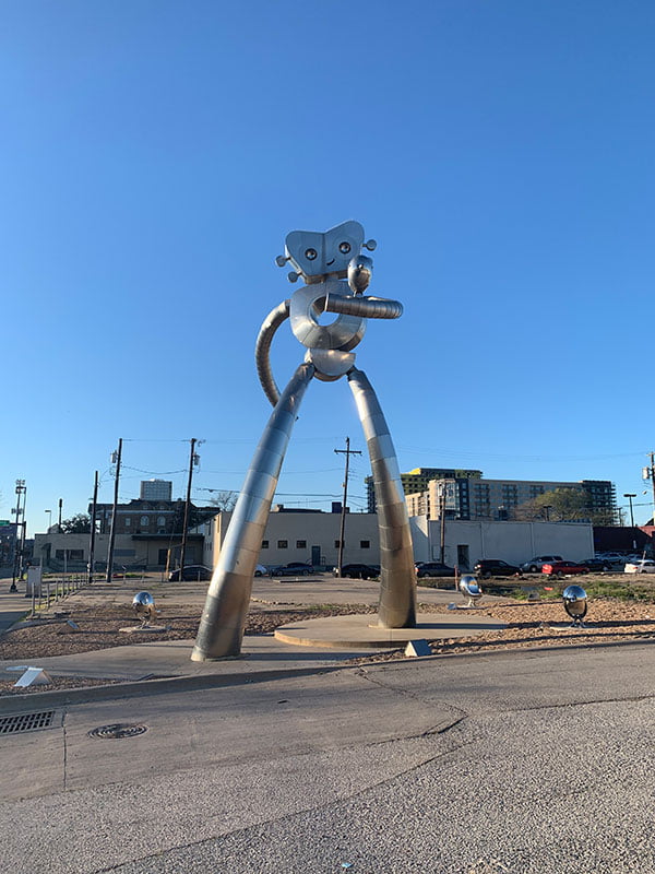 Exploring the Traveling Man Sculpture in Deep Ellum: A Guide for Travelers